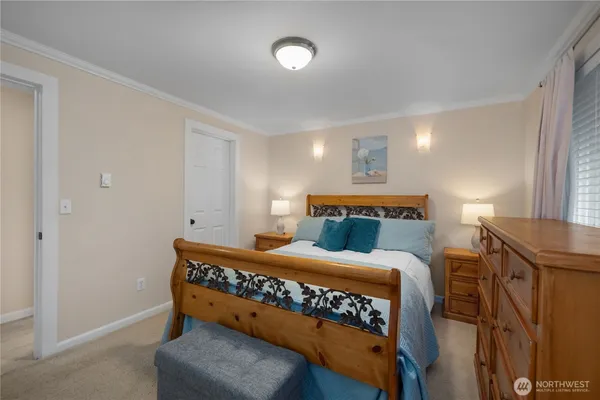 a bedroom with a bed and a table in it