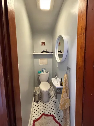 a bathroom with a sink toilet and vanity