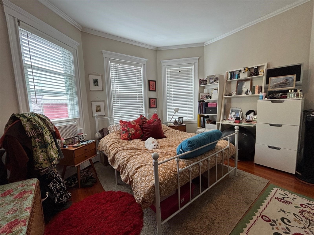 12 White Avenue, Unit 3 Brookline, MA 02467 - Photo 17 of 24 a bedroom with furniture and a window