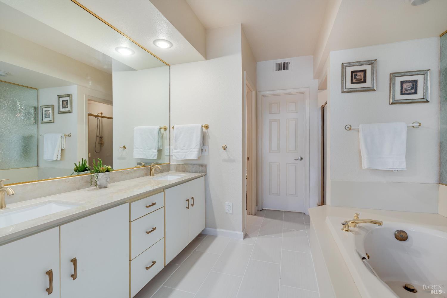 2008 Stonefield Lane Santa Rosa, CA 95403 - Photo 24 of 44 Primary bathroom with tub, double sink vanity and stall shower.