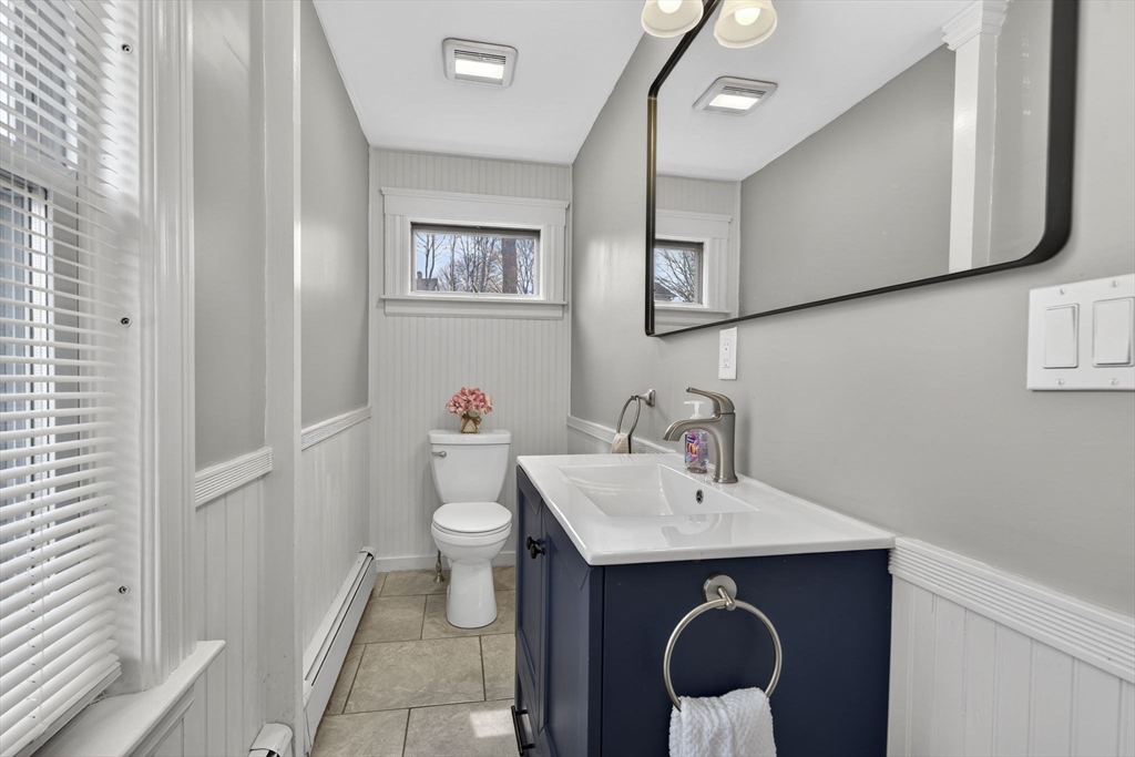 22 Maple Street Templeton, MA 01436 - Photo 11 of 28 a bathroom with a toilet sink and mirror