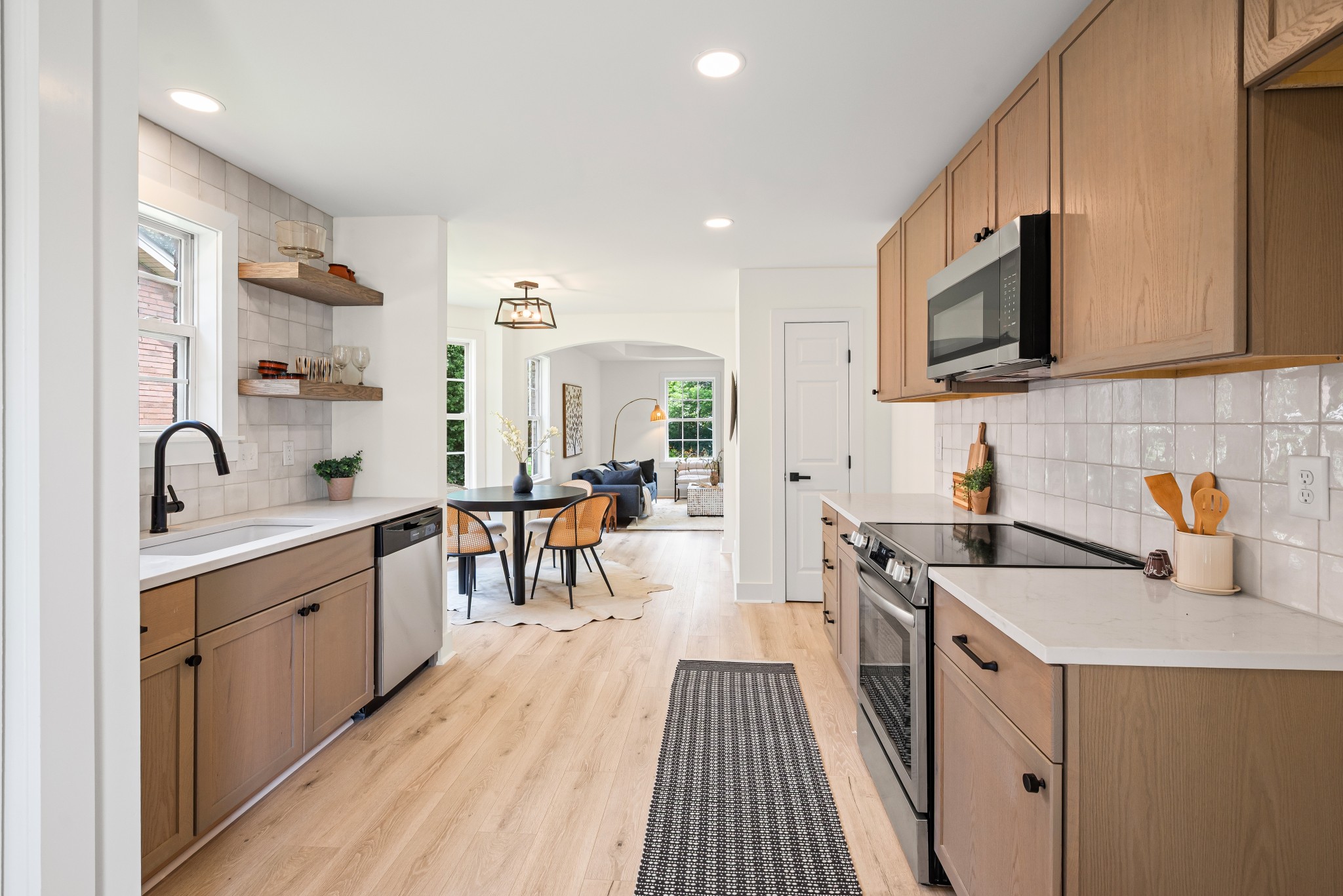 1815 3rd Avenue North Nashville, TN 37208 - Photo 12 of 44 a kitchen with sink a stove and cabinets