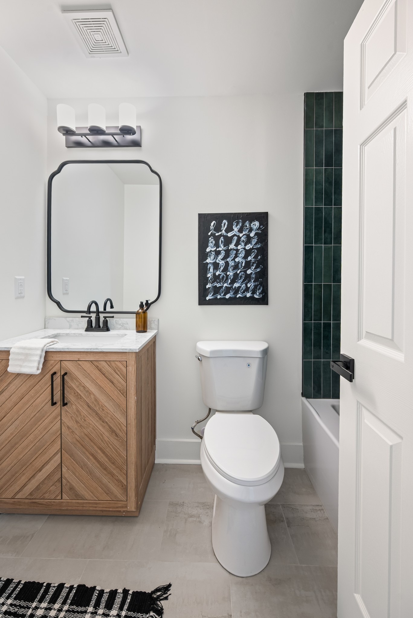 1815 3rd Avenue North Nashville, TN 37208 - Photo 15 of 44 a bathroom with a toilet a sink and mirror