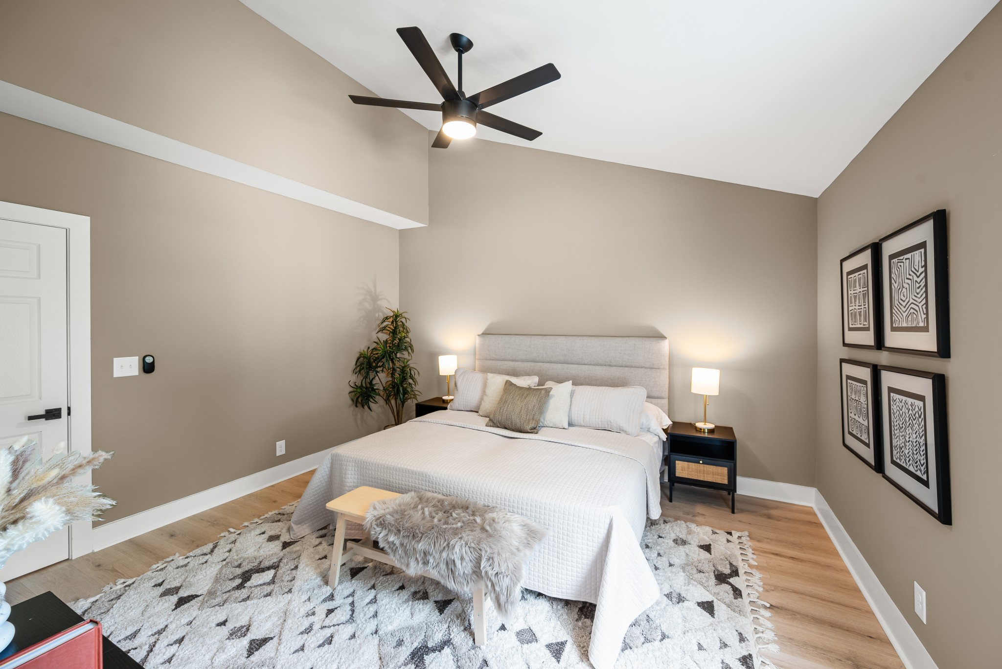 1815 3rd Avenue North Nashville, TN 37208 - Photo 24 of 44 a bedroom with a large bed and a chandelier