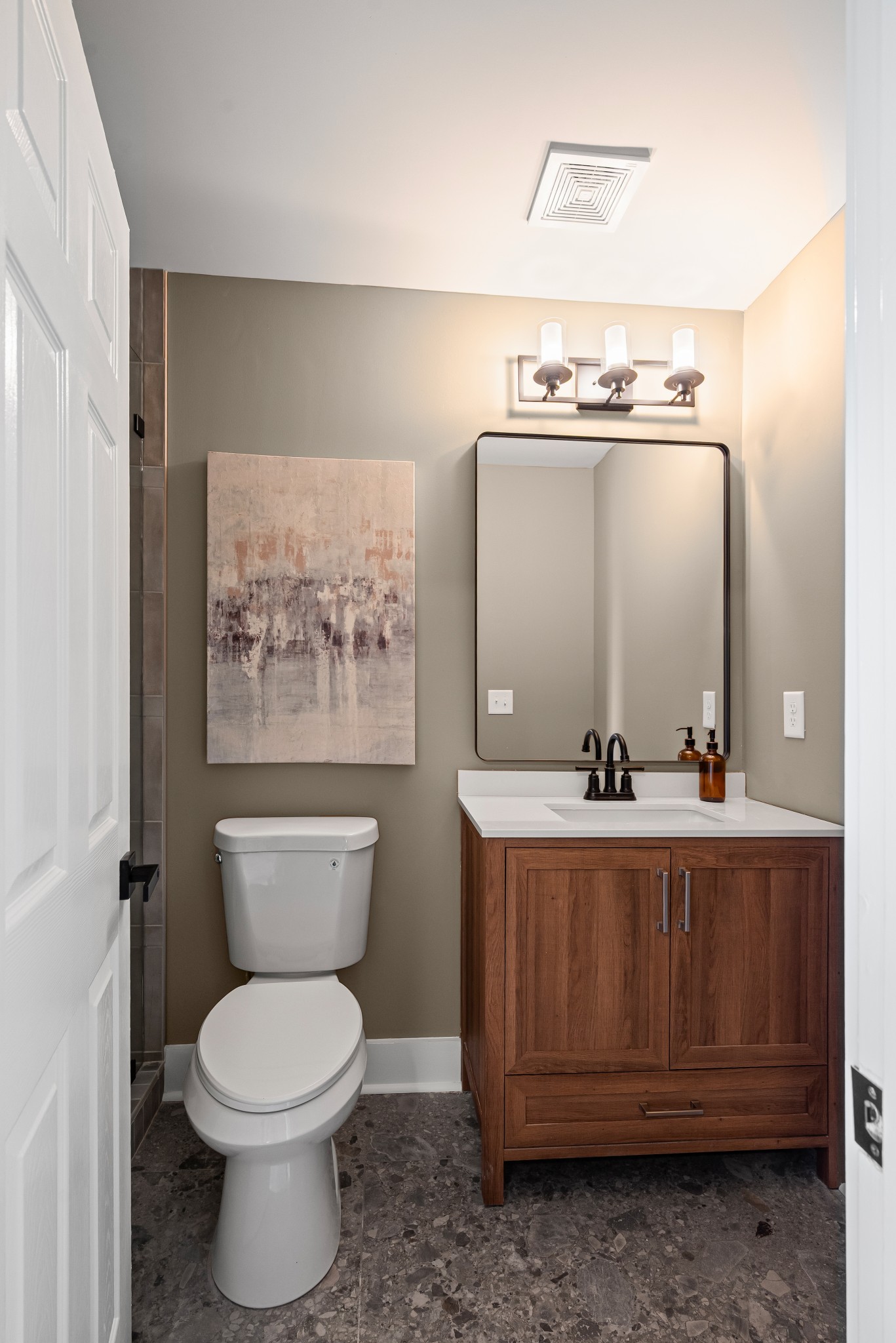 1815 3rd Avenue North Nashville, TN 37208 - Photo 27 of 44 a bathroom with a toilet a sink and mirror
