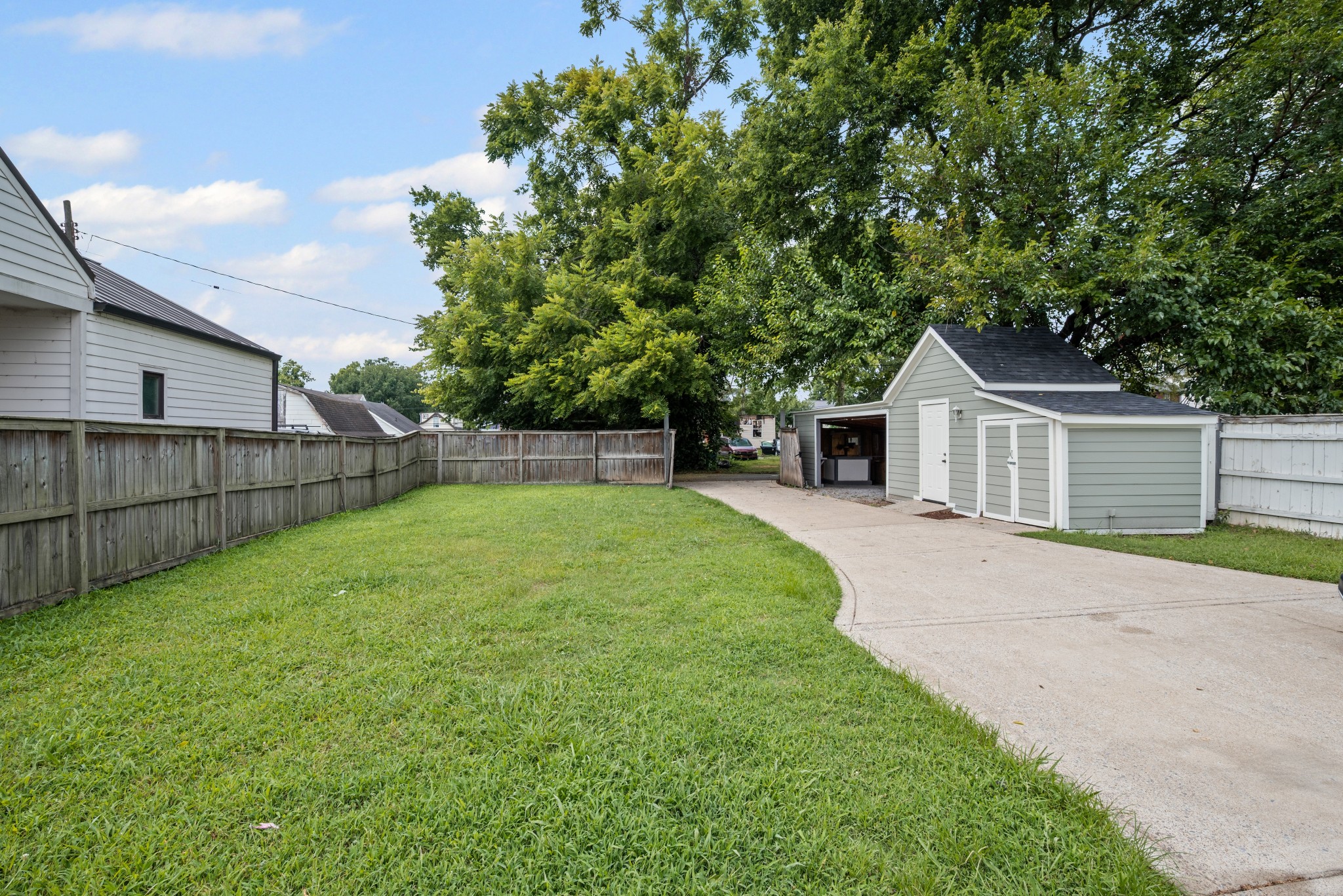 1815 3rd Avenue North Nashville, TN 37208 - Photo 39 of 44 a front view of a house with a yard and garage