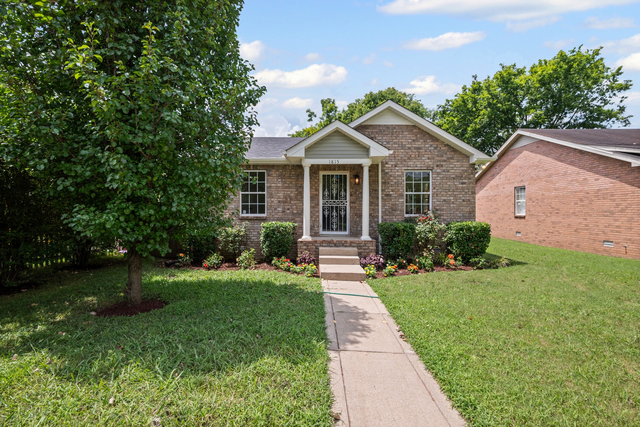 1815 3rd Avenue North Nashville, TN 37208 - Photo 41 of 44 a front view of a house with a yard