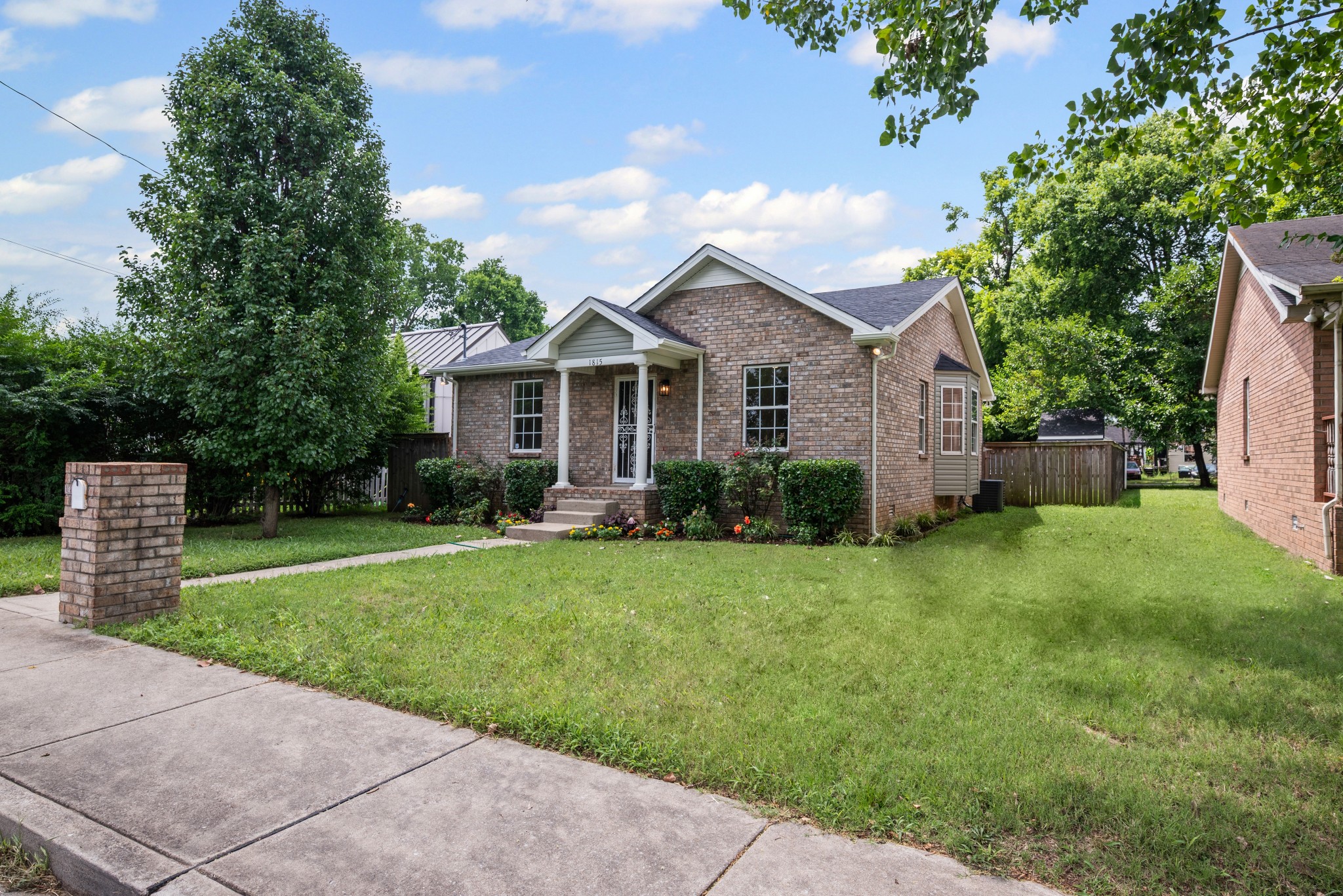 1815 3rd Avenue North Nashville, TN 37208 - Photo 5 of 44 a front view of a house with a garden