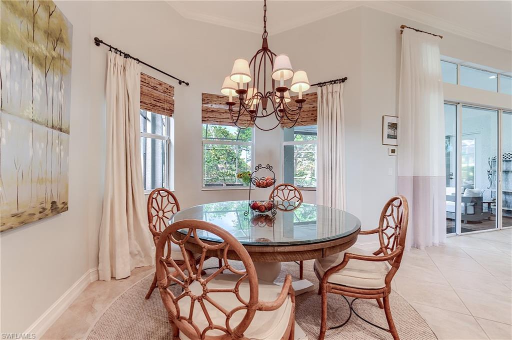 7699 Cottesmore Drive Naples, FL 34113 - Photo 12 of 37 a dining room with furniture and window