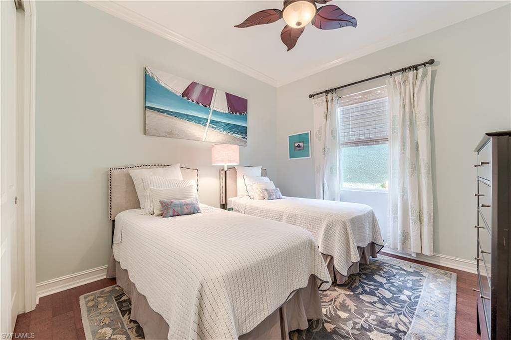 7699 Cottesmore Drive Naples, FL 34113 - Photo 21 of 37 a bedroom with bed and a window
