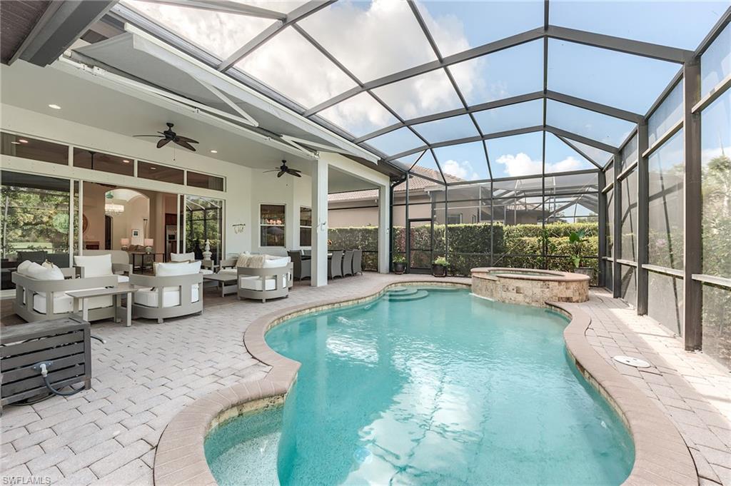 7699 Cottesmore Drive Naples, FL 34113 - Photo 30 of 37 a view of swimming pool with outdoor seating
