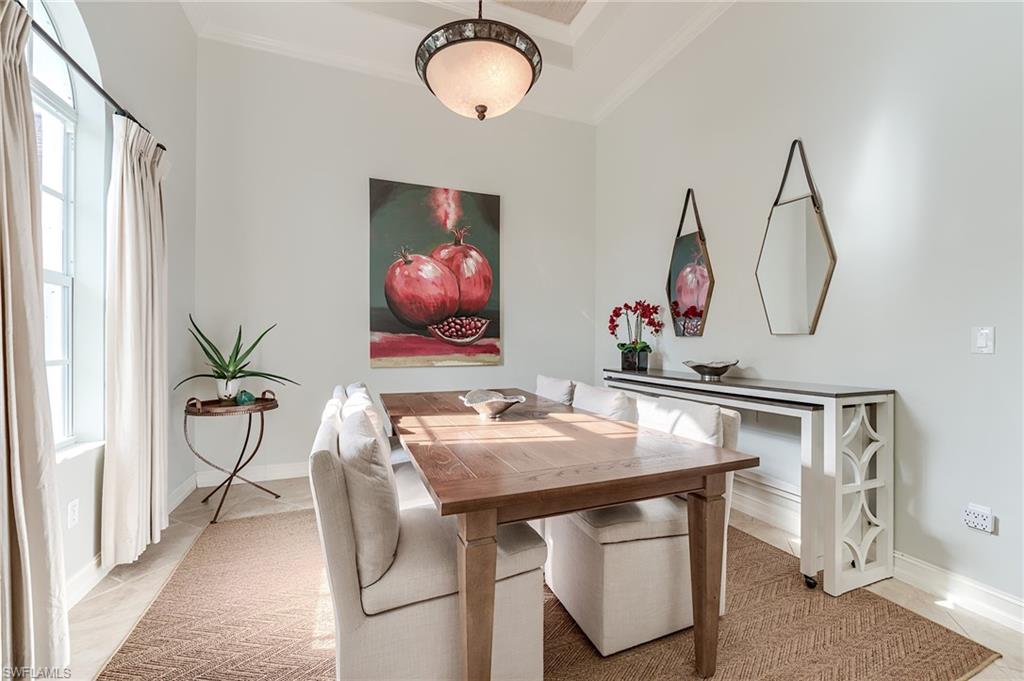 7699 Cottesmore Drive Naples, FL 34113 - Photo 7 of 37 a view of dining room with furniture and front door