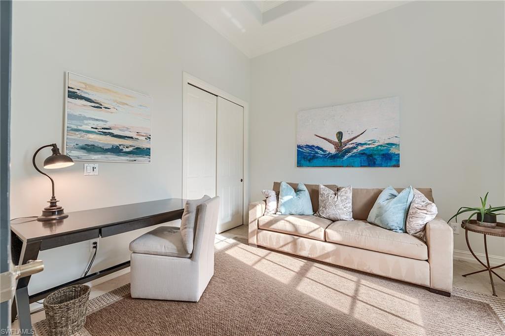 7699 Cottesmore Drive Naples, FL 34113 - Photo 8 of 37 a living room with furniture and a window