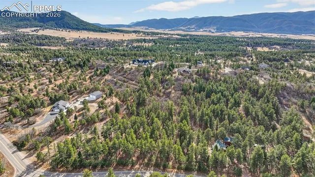 a view of an outdoor space and a mountain