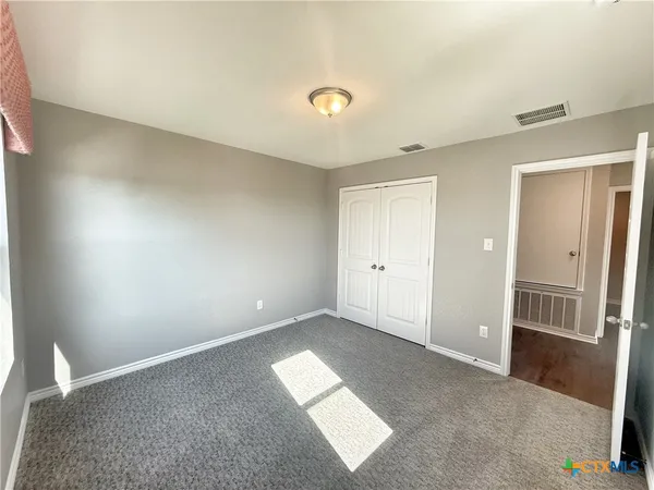 a bathroom with a toilet and a bathtub