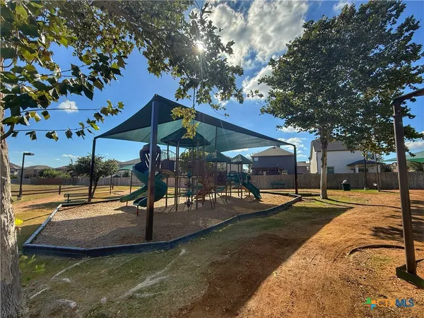a view of a house with a street