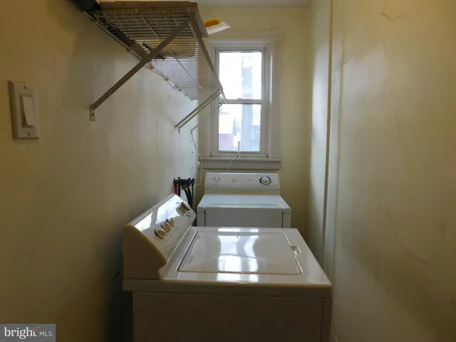 a room with a dresser and a window