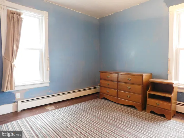 a view of a wooden floor with cabinet