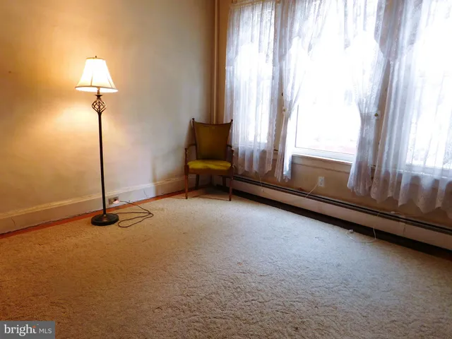 a view of room with window and hardwood floor