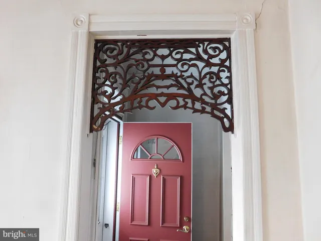 a front view of a door with wooden wall
