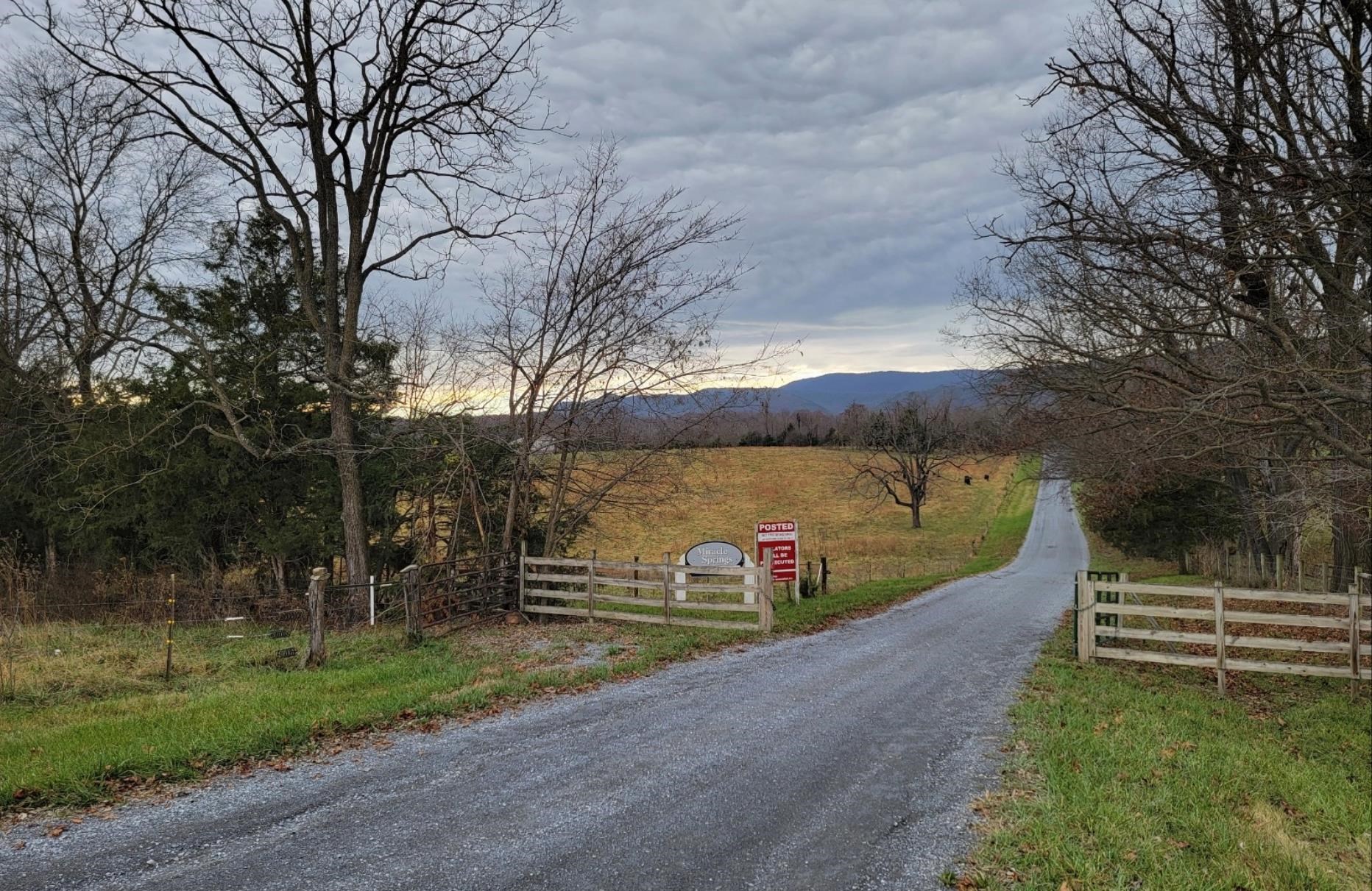 Tbd Miracle Ridge Road Elkton, VA 22827 - Photo 3 of 32 a view of a pathway with a wrought fence