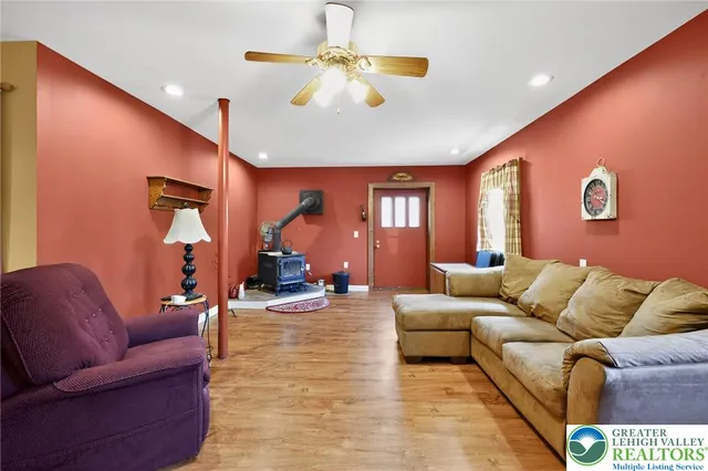 a living room with furniture and a chandelier