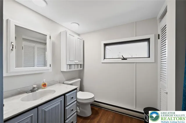 a bathroom with a sink toilet and vanity