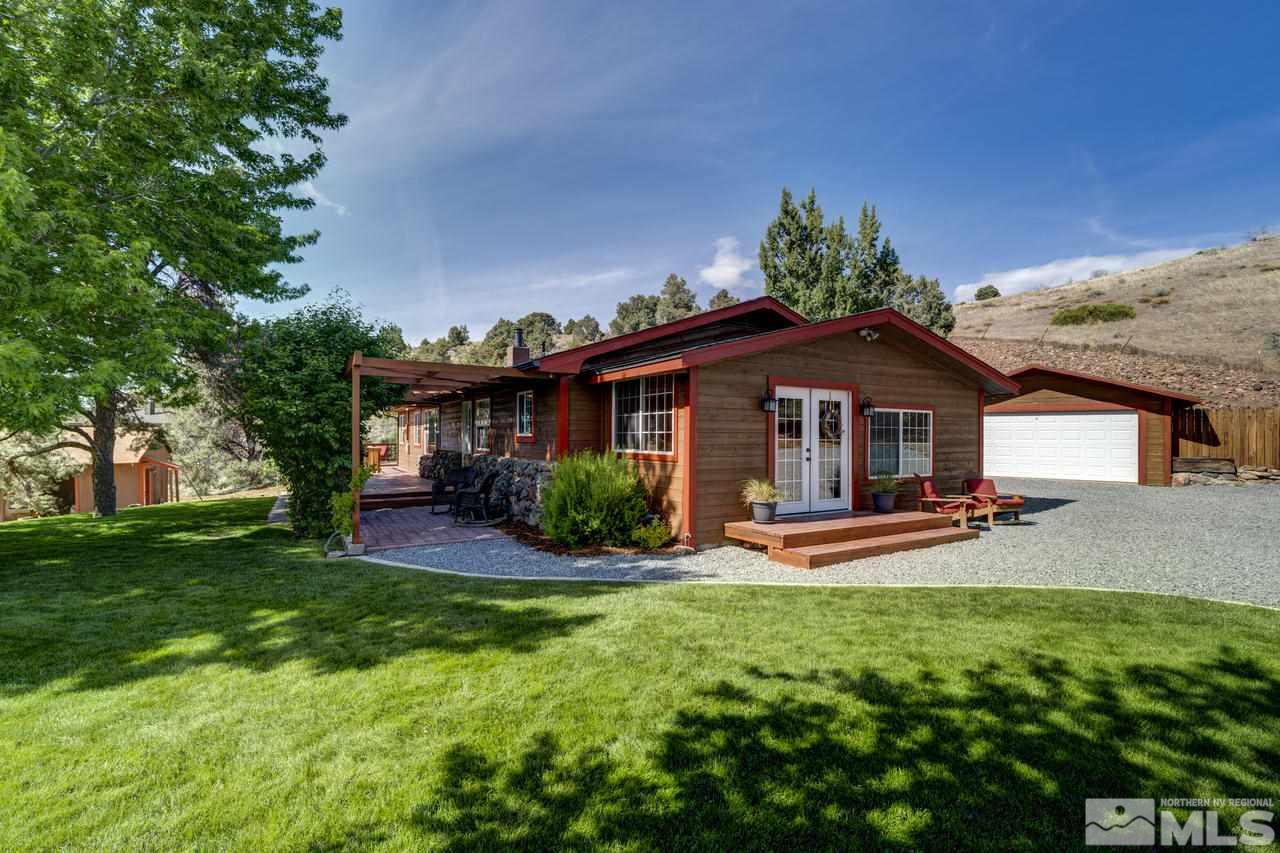 15920 Toll Road Reno, NV 89521 - Photo 1 of 24 a front view of a house with garden