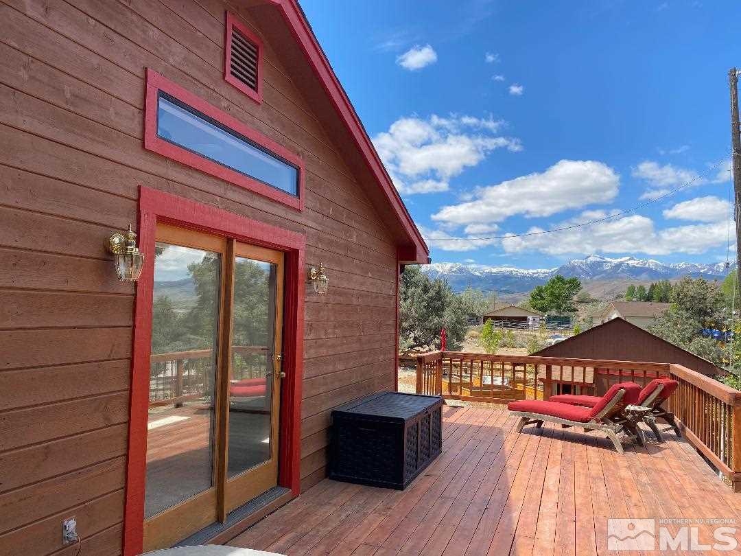 15920 Toll Road Reno, NV 89521 - Photo 11 of 24 a view of a balcony with wooden floor and outdoor seating