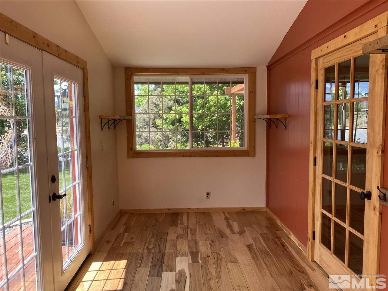 15920 Toll Road Reno, NV 89521 - Photo 13 of 24 a view of a room with wooden floor and windows
