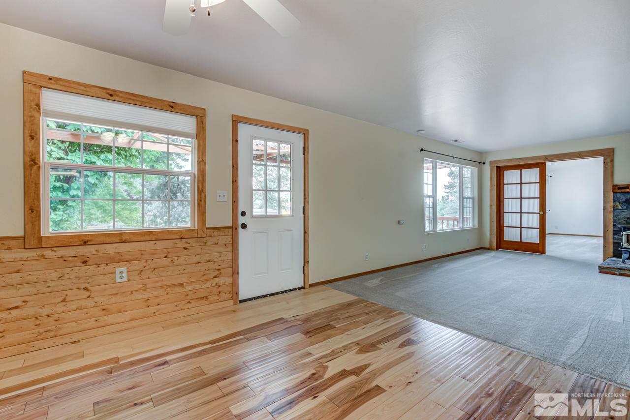 15920 Toll Road Reno, NV 89521 - Photo 16 of 24 an empty room with wooden floor and windows