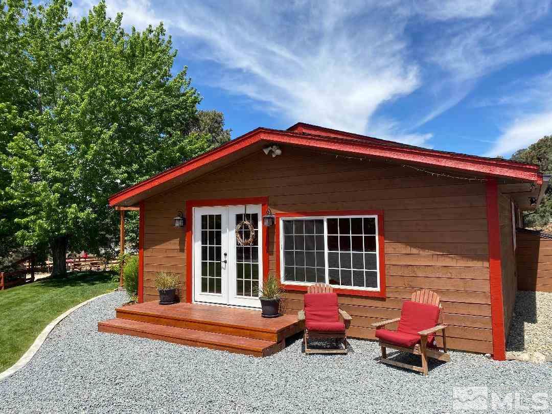 15920 Toll Road Reno, NV 89521 - Photo 4 of 24 a backyard of a house with fountain table and chairs