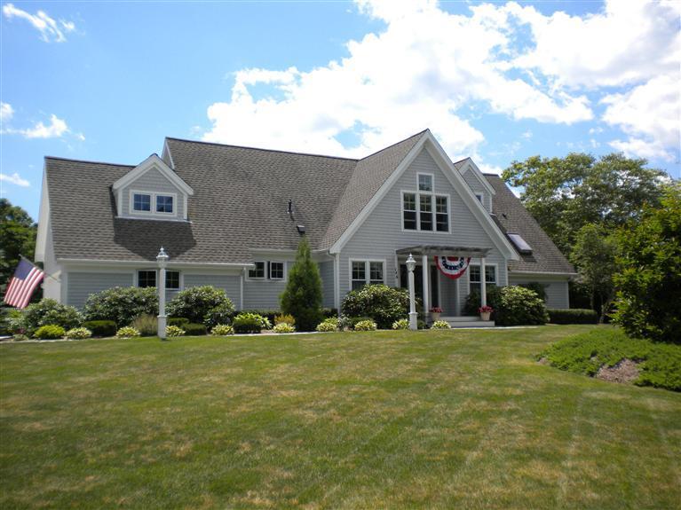 146 Cairn Ridge Road East Falmouth, MA 02536 - Photo 1 of 29 a front view of a house with a yard