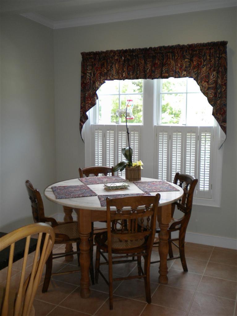 146 Cairn Ridge Road East Falmouth, MA 02536 - Photo 11 of 29 a view of a dining table and chairs in the kitchen