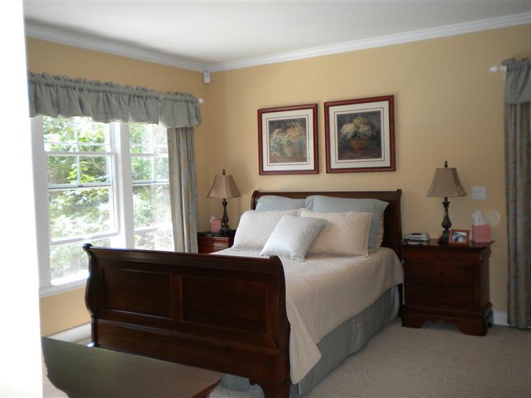 146 Cairn Ridge Road East Falmouth, MA 02536 - Photo 14 of 29 a bedroom with a bed and a dresser next to a window