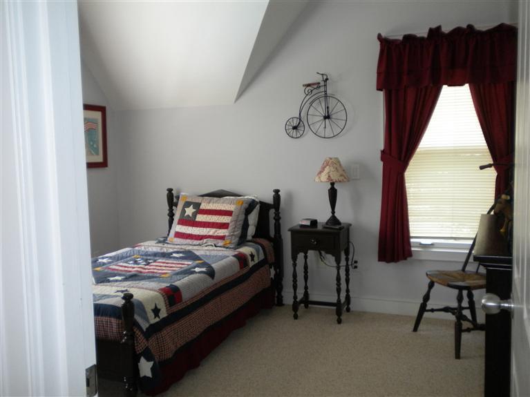 146 Cairn Ridge Road East Falmouth, MA 02536 - Photo 19 of 29 a bedroom with a bed and a window