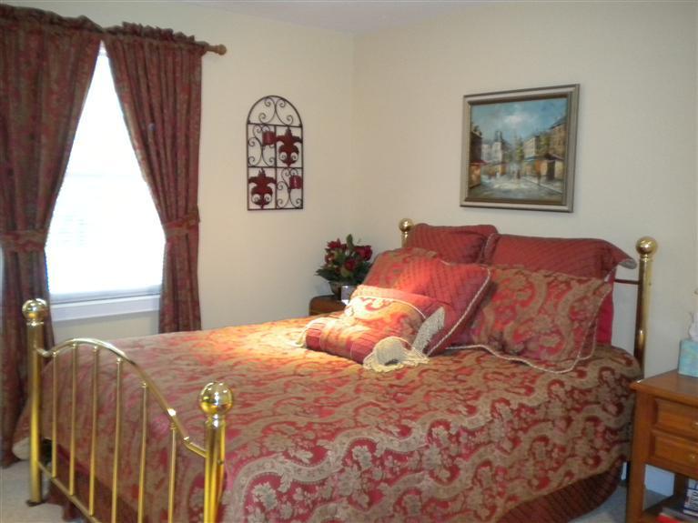 146 Cairn Ridge Road East Falmouth, MA 02536 - Photo 22 of 29 a bedroom with a large bed and a window