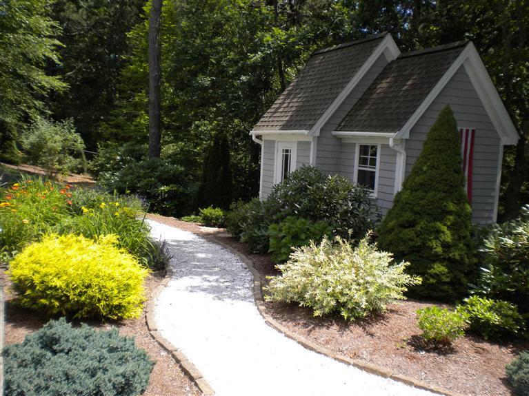 146 Cairn Ridge Road East Falmouth, MA 02536 - Photo 29 of 29 a front view of a house with a yard