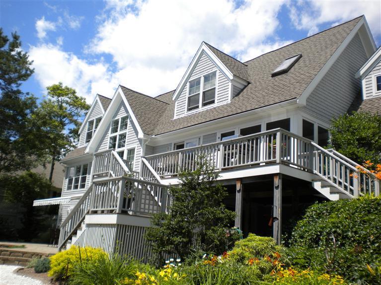 146 Cairn Ridge Road East Falmouth, MA 02536 - Photo 3 of 29 a front view of a house with balcony