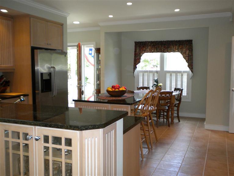 146 Cairn Ridge Road East Falmouth, MA 02536 - Photo 9 of 29 a kitchen with granite countertop a table and chairs in it