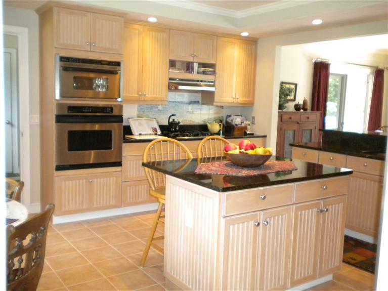 146 Cairn Ridge Road East Falmouth, MA 02536 - Photo 10 of 29 a kitchen with stainless steel appliances granite countertop a stove top oven a sink a counter space and cabinets