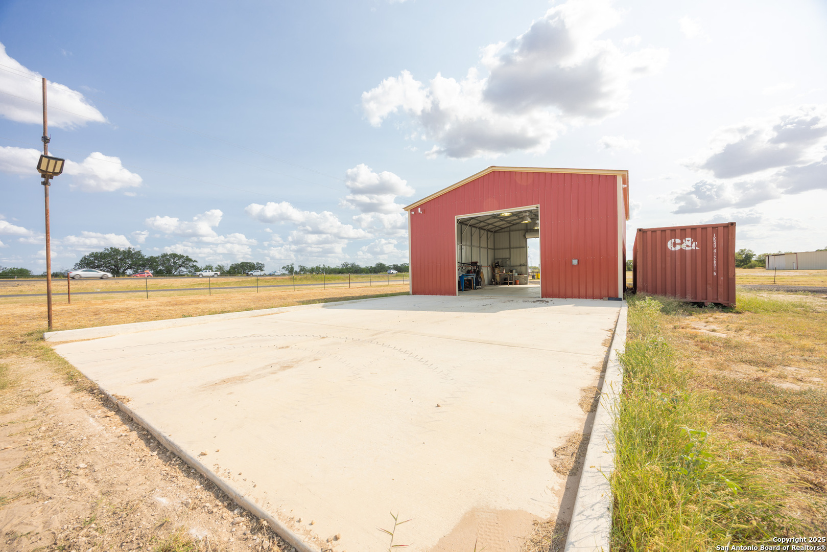 14951 Interstate 35 Moore, TX 78057 - Photo 3 of 26 a view of a swimming pool with an outdoor space and seating area