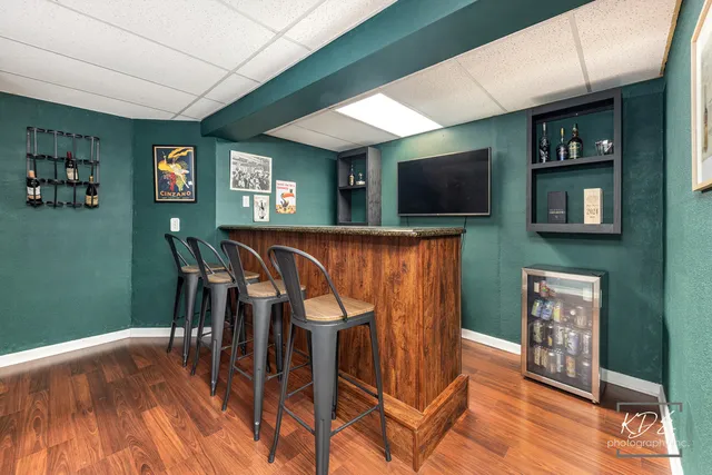 a dinning room with furniture and wooden floor
