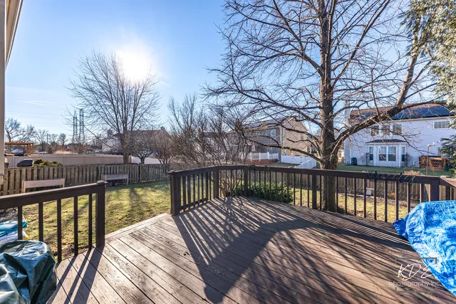 a view of balcony with wooden floor and fence