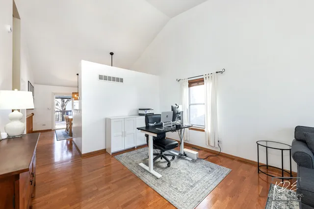 a workspace with furniture and wooden floor