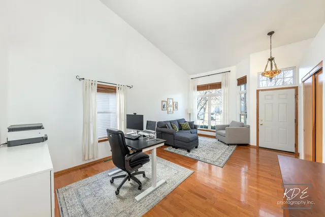 a living room with furniture rug and window