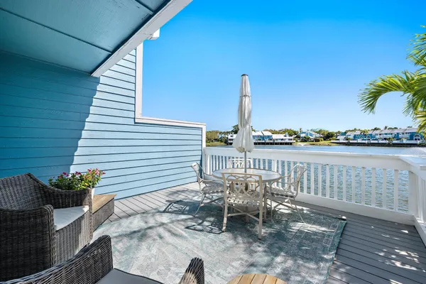 a view of a chairs and table on the wooden floor