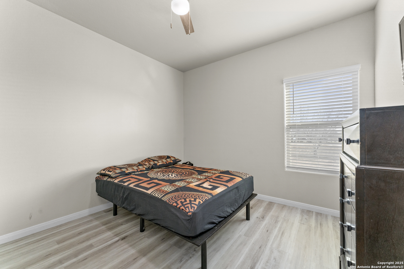 16851 Griffin Road, Unit 2 Atascosa, TX 78002 - Photo 11 of 37 a living room with a bed furniture and a window