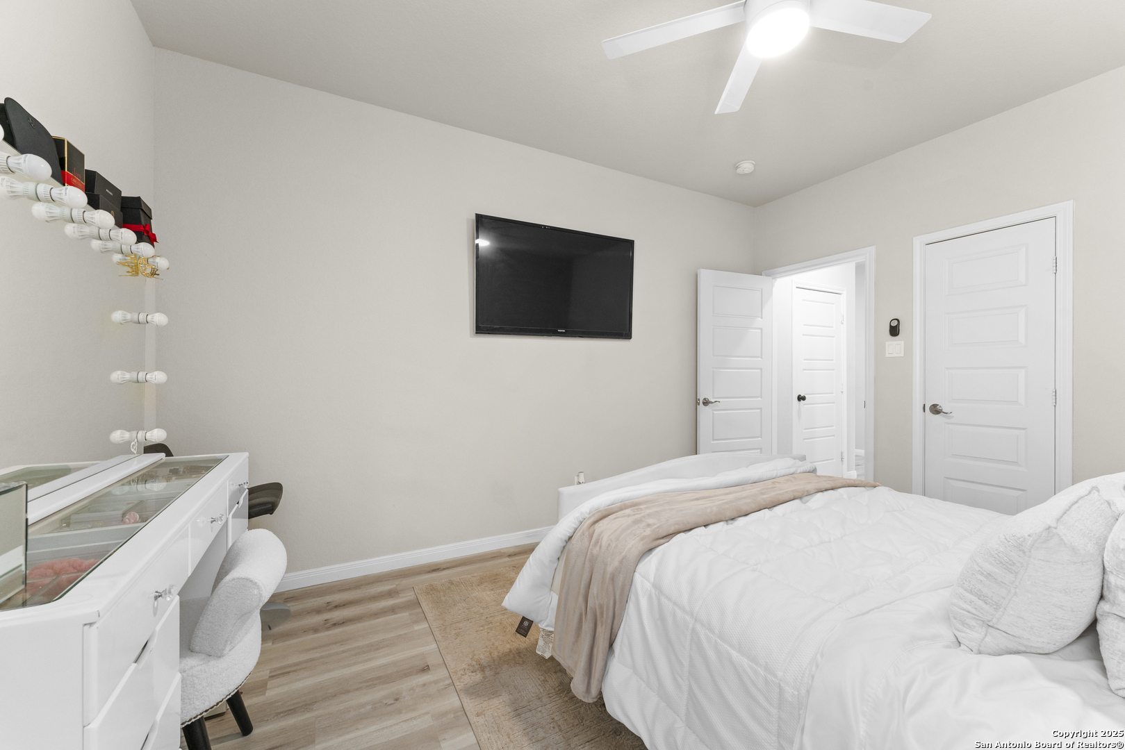 16851 Griffin Road, Unit 2 Atascosa, TX 78002 - Photo 13 of 37 a bedroom with a bed and a flat screen tv