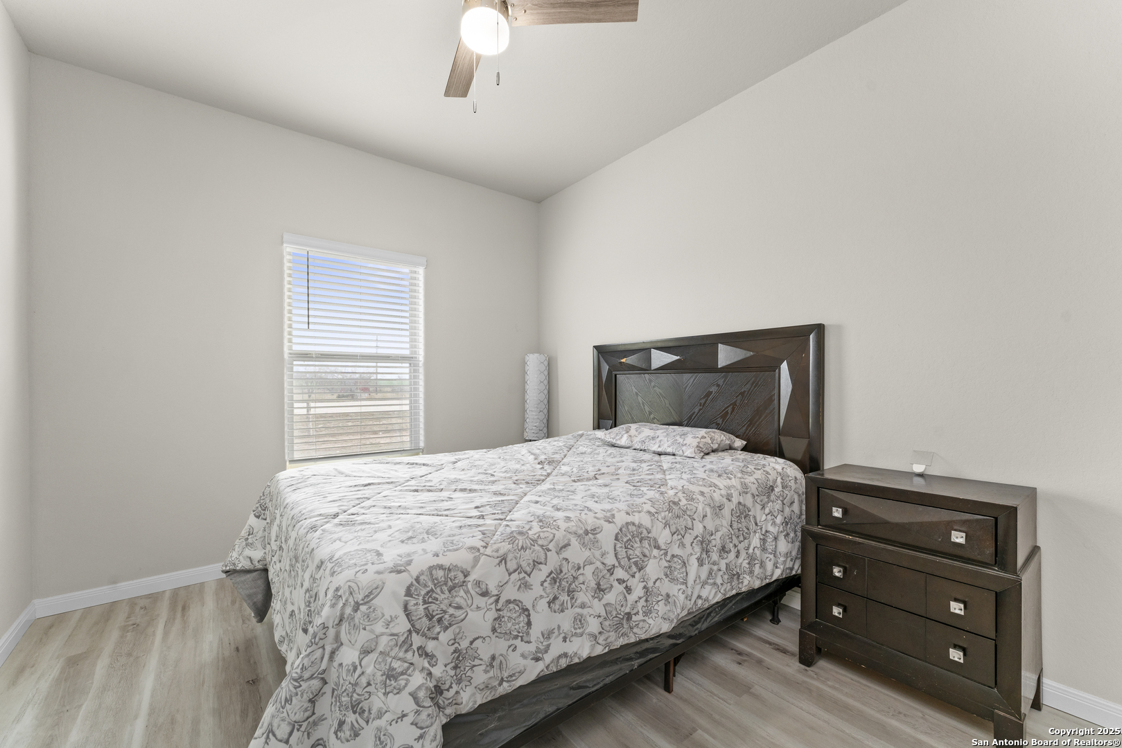 16851 Griffin Road, Unit 2 Atascosa, TX 78002 - Photo 14 of 37 a bedroom with a bed and a window